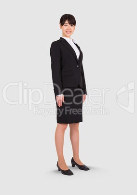 Full body portrait of woman standing with grey background