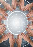 Hands in circle around technology interface