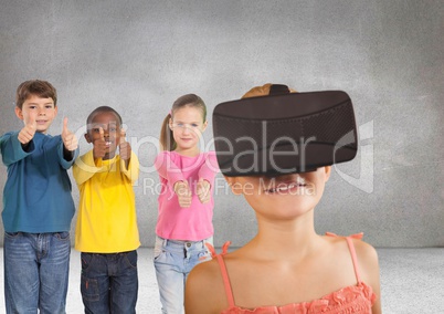 Kids pointing at girl with VR headset in grey room