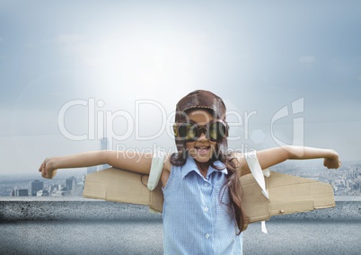 Pilot girl with wings over city background