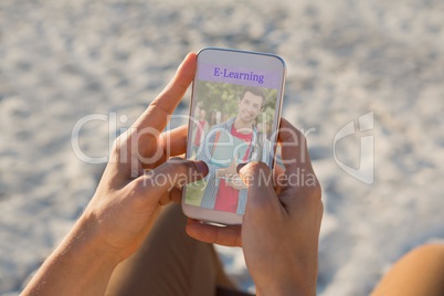Person using a phone  with e-learning information in the screen