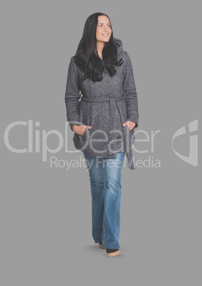Full body portrait of woman standing with grey background