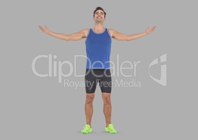 Full body portrait of athletic Man standing with grey background