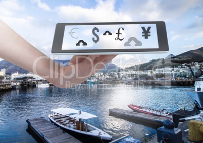 Holding tablet and currency upload online over marina