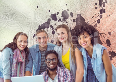 Happy young students using a computer against white, red and purple splattered background