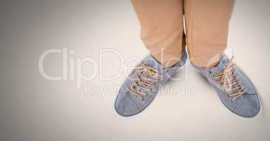 Man's feet and shoes on grey background