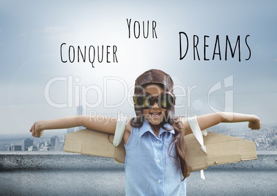 Conquer your dreams text and Pilot girl with wings over city background
