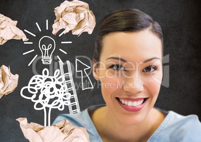 Woman standing next to light bulb drawings with crumpled paper balls in front of blackboard