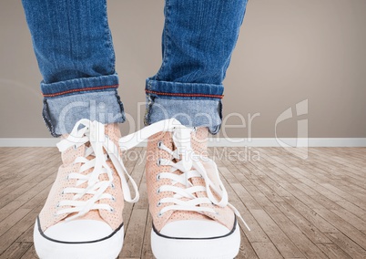 Feet and shoes on wooden floor