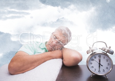 Man sleeping next to clock with sky clouds