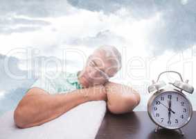 Man sleeping next to clock with sky clouds
