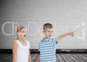 kids pointing surprised with blank room background