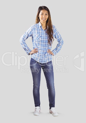 Full body portrait of woman standing with grey background