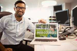 Man holding a computer with e-learning information in the screen