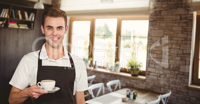 Happy small business owner man holding a coffee