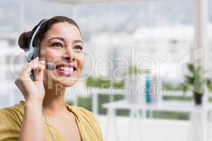 Happy customer care representative woman against office background