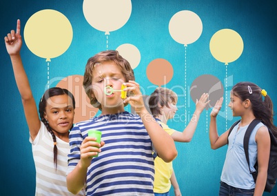 Kids in front of blue background with colorful balloons