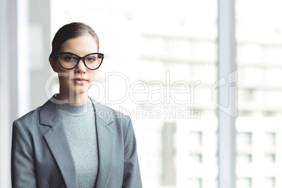 Business woman standing against white blurred background