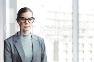 Business woman standing against white blurred background