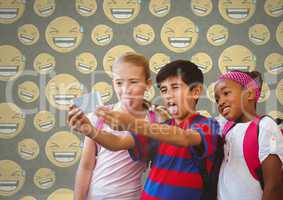 Kids taking selfie in blank room with smiley faces laughing