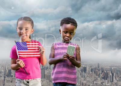 kids holding american flag and phone with city background