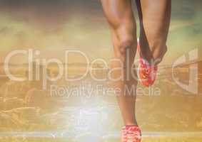 Athletic legs running in bright landscape