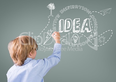 Boy writing in front of grey blank background with idea graphics