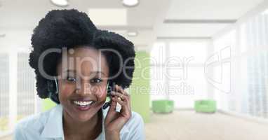 Happy business woman talking on the phone against office background