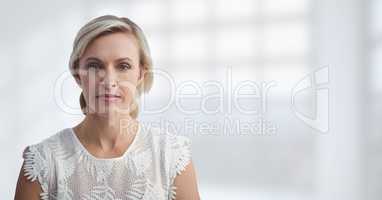 Business woman standing against white blurred background