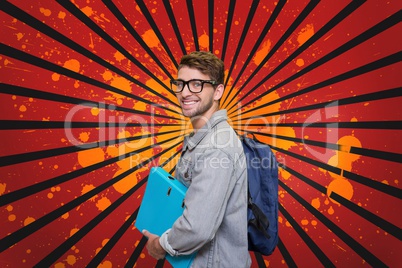 Happy young student man holding a folder against red, black and orange splattered background