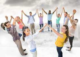 Circle of people holding hands together in clouds