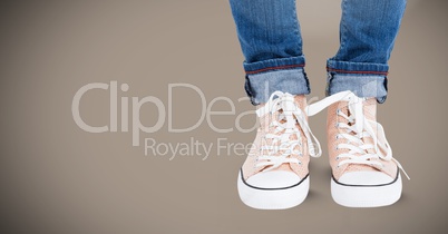 Feet and shoes with brown background