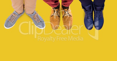 Feet and shoes with yellow background