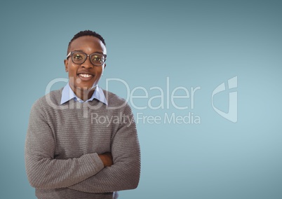 Happy business man standing against blue background