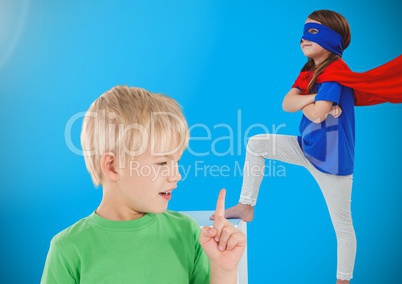 Boy and superhero girl with blue background