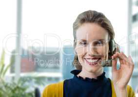 Happy customer care representative woman against office background