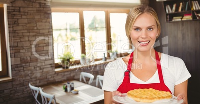 Small business owner woman holding a cake