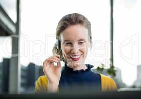 Happy customer care representative woman against city background