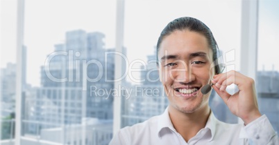 Happy customer care representative man against city background