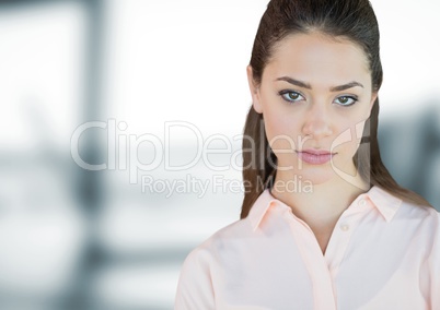 Business woman standing against blue blurred background