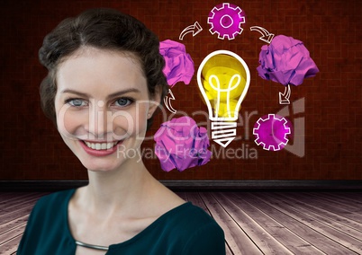 Woman standing next to light bulb with crumpled paper balls