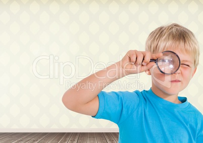 Boy holding magnifying glass with room background