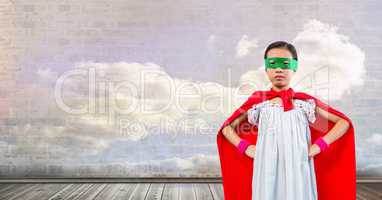 Superhero girl with sky clouds wall
