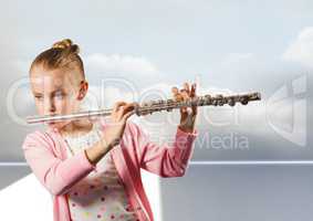 Girl playing the flute in front of clouds