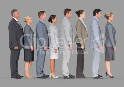 Full body portrait of business people standing in line with grey background