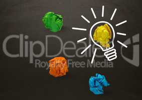 Light bulb with crumpled colorful paper balls and blackboard