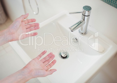 Washing hands in sink