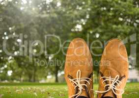 Shoes relaxing feet in front of trees