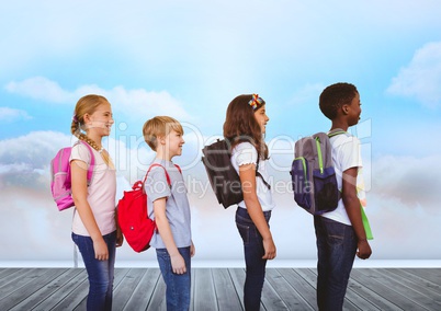 Kids with bags in front of sky clouds