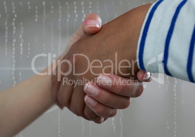 Business people shaking hands against grey background